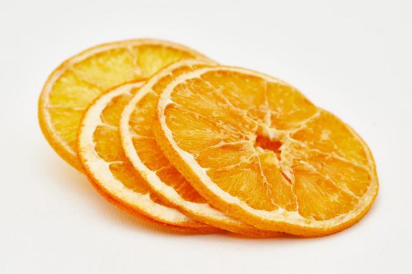 What are the properties of dried orange fruit?
